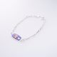 PULSERA CON PLACA DE FLOR DE NIÑO  ESMALTADA